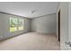 Spacious bedroom with cozy carpeting, great natural light, and ample closet space at 151 Lillyfield Dr, Rockwell, NC 28138