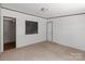 A large bedroom with neutral colored carpet and a closet at 151 Lillyfield Dr, Rockwell, NC 28138