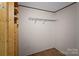 Empty closet featuring shelving and wood-look flooring at 151 Lillyfield Dr, Rockwell, NC 28138