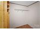 Walk-in closet with wood trim, a wood shelf and a wire shelf for optimal storage at 151 Lillyfield Dr, Rockwell, NC 28138