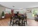 Dining area featuring wood-look flooring and an adjacent kitchen with modern appliances at 151 Lillyfield Dr, Rockwell, NC 28138
