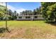 Ranch-style home with light-colored siding and brick accents, nestled in a wooded area at 151 Lillyfield Dr, Rockwell, NC 28138