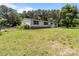 Charming single-story home with a well-maintained lawn and mature trees at 151 Lillyfield Dr, Rockwell, NC 28138