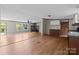 Functional kitchen with wood cabinets, black appliances, and an open layout to the living area at 151 Lillyfield Dr, Rockwell, NC 28138