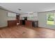 Functional kitchen with wood cabinets, black appliances, and a view of the backyard at 151 Lillyfield Dr, Rockwell, NC 28138