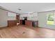 Bright kitchen featuring wood-look flooring and an adjacent dining area with modern appliances at 151 Lillyfield Dr, Rockwell, NC 28138