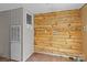 Functional laundry room features wood accent wall and convenient washer/dryer hookups at 151 Lillyfield Dr, Rockwell, NC 28138