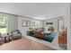 Cozy living room with a sitting area and bright windows at 151 Lillyfield Dr, Rockwell, NC 28138