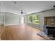 Cozy living room featuring a decorative fireplace and lots of natural light at 151 Lillyfield Dr, Rockwell, NC 28138