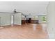 Bright open-concept living room and kitchen with wood-look flooring and neutral paint at 151 Lillyfield Dr, Rockwell, NC 28138