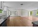 Open-concept living room with a seamless flow and wood flooring throughout at 151 Lillyfield Dr, Rockwell, NC 28138