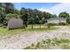 View of the backyard with outbuildings, including a storage shed and garage, with plenty of parking at 151 Lillyfield Dr, Rockwell, NC 28138