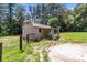 Backyard shed with wooden frame and red metal roof at 151 Lillyfield Dr, Rockwell, NC 28138