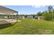 Expansive backyard featuring a covered patio, offering ample space for outdoor activities and entertaining at 155 Trail Wood Ct, Salisbury, NC 28146
