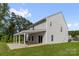 Large backyard features a covered patio perfect for relaxing or entertaining al fresco at 155 Trail Wood Ct, Salisbury, NC 28146