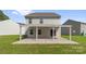 An open backyard patio provides an outdoor space for relaxing or entertaining friends and Gathering at 155 Trail Wood Ct, Salisbury, NC 28146