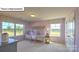 Bedroom featuring pink walls, a canopy bed, a dresser, and a window with outdoor views at 160 Asmodean Ln, Troutman, NC 28166
