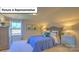 Bedroom featuring a tufted headboard, two nightstands, a window, and neutral walls and carpet at 160 Asmodean Ln, Troutman, NC 28166