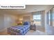 Bedroom with plaid bed, nightstands, golf decor, and a window overlooking the neighborhood at 160 Asmodean Ln, Troutman, NC 28166