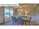 Bright dining room with large windows and recessed lights at 160 Asmodean Ln, Troutman, NC 28166