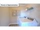 Functional laundry room with modern washer, dryer and shelving at 160 Asmodean Ln, Troutman, NC 28166