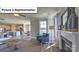 Cozy living room featuring fireplace, hardwood floors, and ample natural light at 160 Asmodean Ln, Troutman, NC 28166