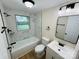 This is a renovated bathroom with a tub, and modern white and black fixtures at 20016 Walter Henderson Rd, Cornelius, NC 28031