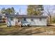 Side view of single-story home featuring a well-maintained yard at 20016 Walter Henderson Rd, Cornelius, NC 28031