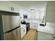 Renovated kitchen with stainless steel appliances and white cabinets at 20016 Walter Henderson Rd, Cornelius, NC 28031