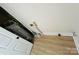 This is a utility area with wood flooring and a water heater at 20016 Walter Henderson Rd, Cornelius, NC 28031