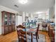 Cozy dining space featuring hardwood floors and access to the bright kitchen at 202 College Ave, Shelby, NC 28152