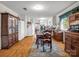 Warm dining room with natural light, hardwood floors, and storage at 202 College Ave, Shelby, NC 28152