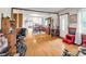 Open floor plan view of dining area with hardwood floors flowing into the kitchen with natural light at 202 College Ave, Shelby, NC 28152