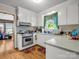 Efficient kitchen boasting white cabinets, laminate countertops, and a stainless steel range at 202 College Ave, Shelby, NC 28152