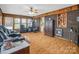 Cozy living room featuring brick accent wall, wood trim, and comfortable seating area at 202 College Ave, Shelby, NC 28152