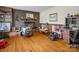 Warm living room featuring a brick fireplace with mantle, hardwood floors, and ample space at 202 College Ave, Shelby, NC 28152