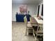 Inviting dining room featuring a charming dining set and a stylish blue console table with floral artwork at 202 Kenwood Ave, Cherryville, NC 28021