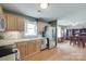 Open kitchen with stainless steel appliances and wood floors leading to a dining area at 2023 E Park Dr, Lancaster, SC 29720