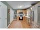 Functional kitchen with wood cabinets, stainless steel refrigerator, and modern backsplash at 2023 E Park Dr, Lancaster, SC 29720