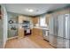 Well-equipped kitchen with stainless steel appliances, wood cabinets, and modern backsplash at 2023 E Park Dr, Lancaster, SC 29720
