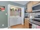 Laundry area featuring a washer, dryer, and storage shelves at 2023 E Park Dr, Lancaster, SC 29720