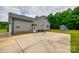 View of the back of the house with a large concrete patio and green yard at 2027 Ellison Dr, Rock Hill, SC 29730