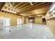 Spacious unfinished basement with concrete floor, exposed ceiling, and ample room for storage or customization at 2027 Ellison Dr, Rock Hill, SC 29730