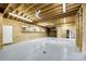 Unfinished basement space with exposed beams, storage, lighting, and a doorway at 2027 Ellison Dr, Rock Hill, SC 29730