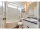 Bathroom with a tub and shower, a window, a toilet, and a vanity with a sink and storage at 2027 Ellison Dr, Rock Hill, SC 29730