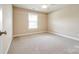 Bright bedroom with neutral carpet and paint and a window allowing lots of natural light at 2027 Ellison Dr, Rock Hill, SC 29730