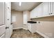 Spacious laundry room with plenty of storage cabinets and a countertop area at 2027 Ellison Dr, Rock Hill, SC 29730