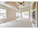 Spacious bedroom featuring tray ceiling, plush carpet, and ample natural light at 2027 Ellison Dr, Rock Hill, SC 29730