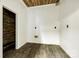 Cozy room featuring wood-look flooring, white walls and ceiling, and modern outlets, ready for your personal touch at 2027 Ellison Dr, Rock Hill, SC 29730