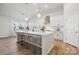 Bright kitchen with large island, stainless steel appliances, and modern lighting at 2045 Mantle Ridge Dr, Indian Trail, NC 28079